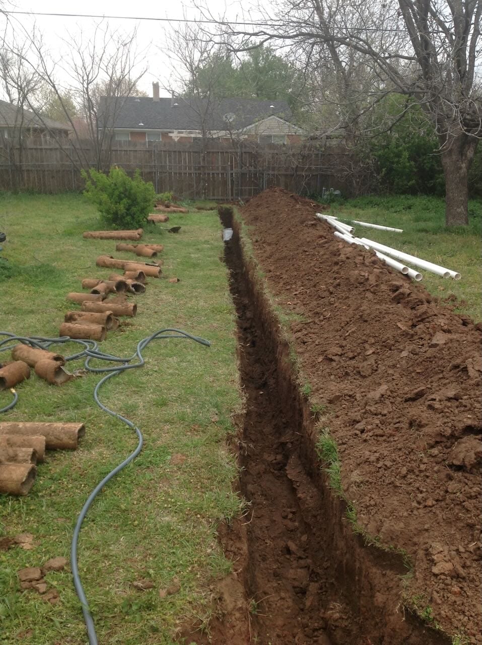 Color collage of Grace's old sewer line completely removed.