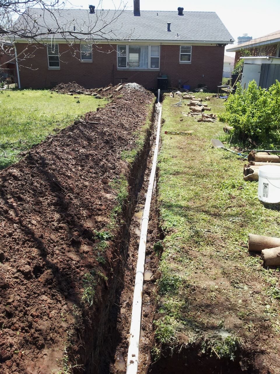 Color photo of Grace's new sewer line layed in the trench.