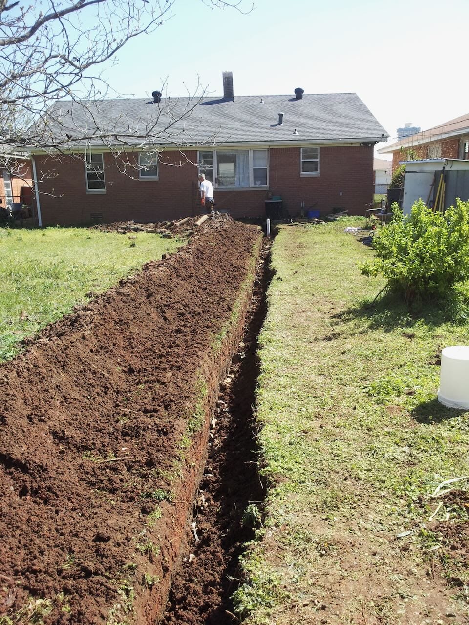 Color photo of Grace's new sewer line after being partially covered.