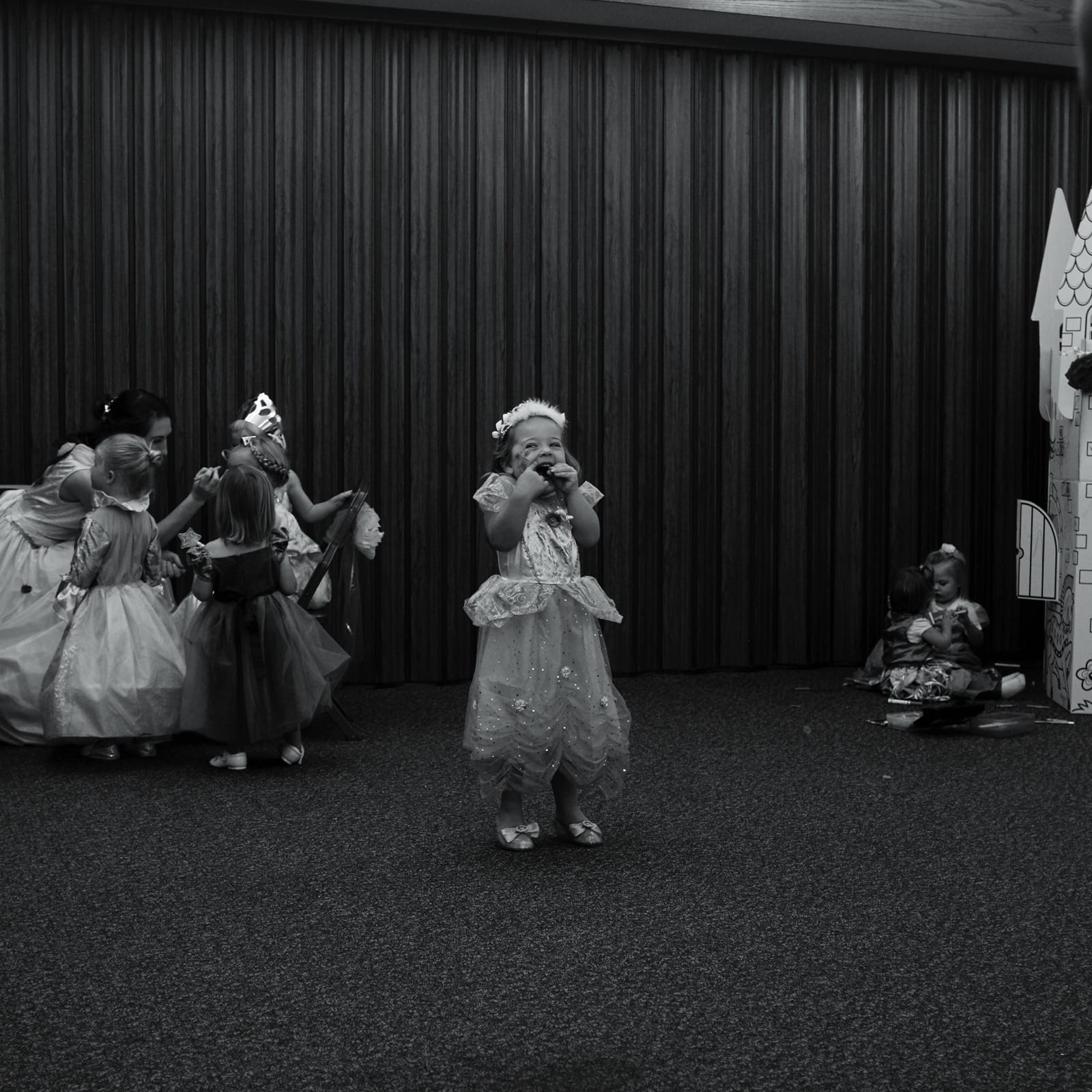 B&W photo of Avery grinning with joy.