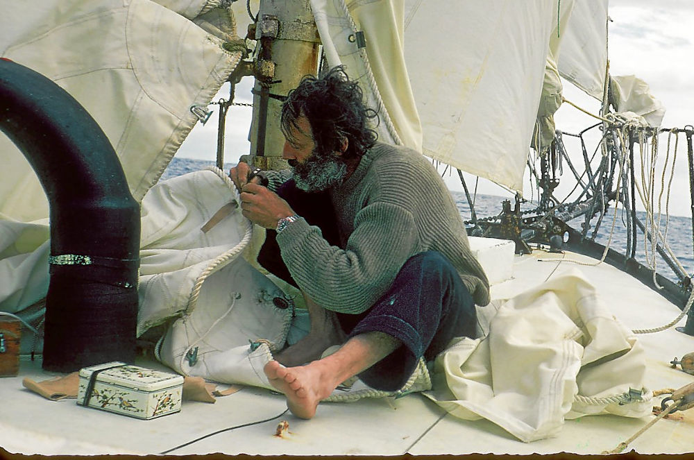 Bernard Moitessier repairing a sail.