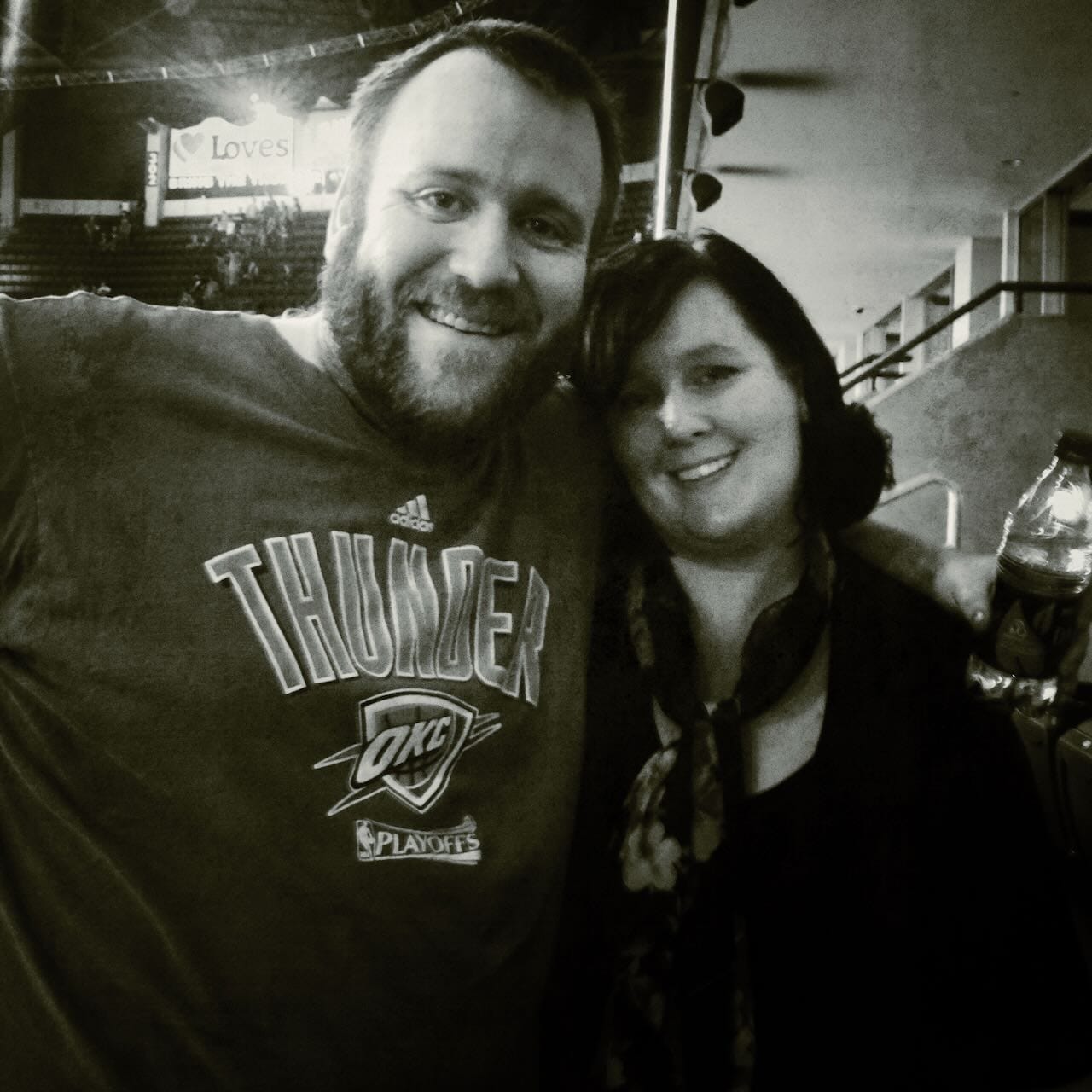 B&W photo of Grace and I at a Thunder game.
